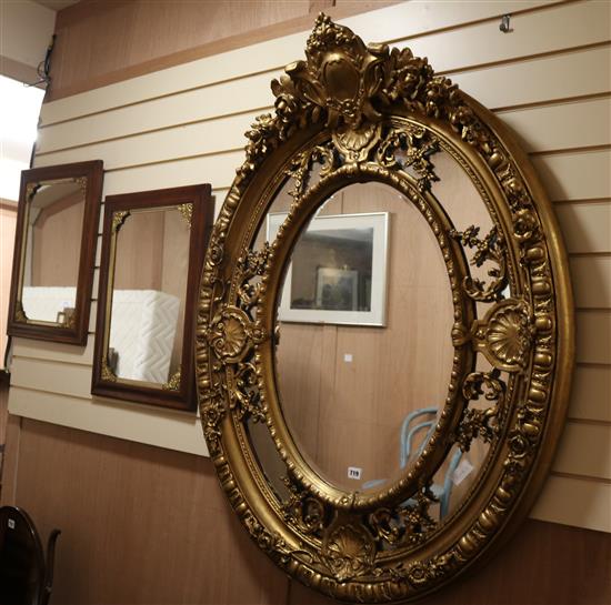 An oval gilt framed mirror W.96cm